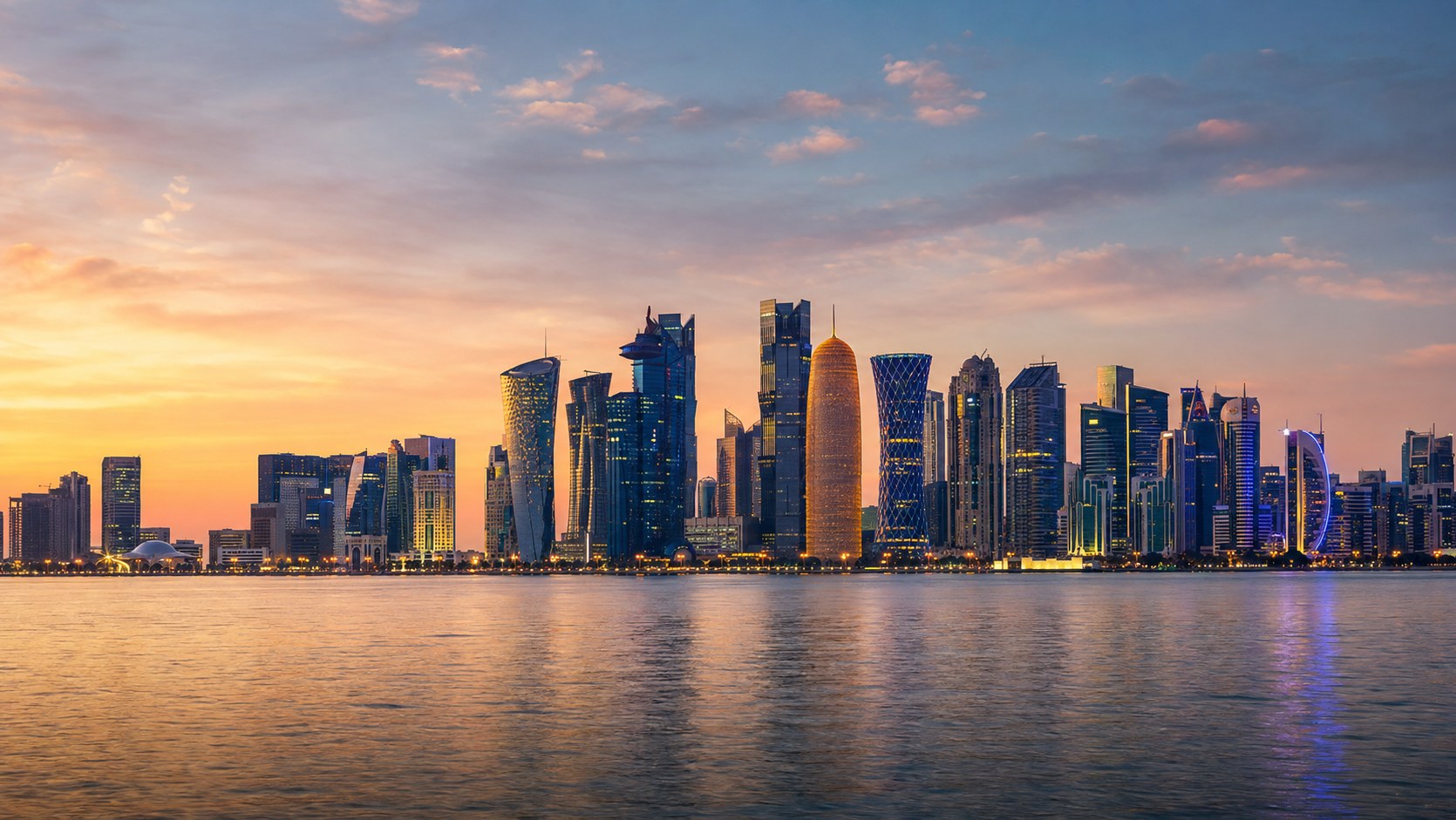 The Doha skyline at sunset seen across the bay