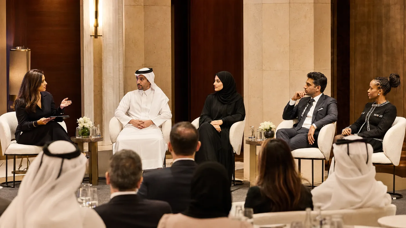 Panel discussion on practical AI implementation in front of a seated audience