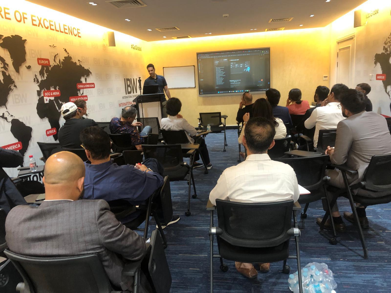 Audience and speaker at an AI Mavericks session