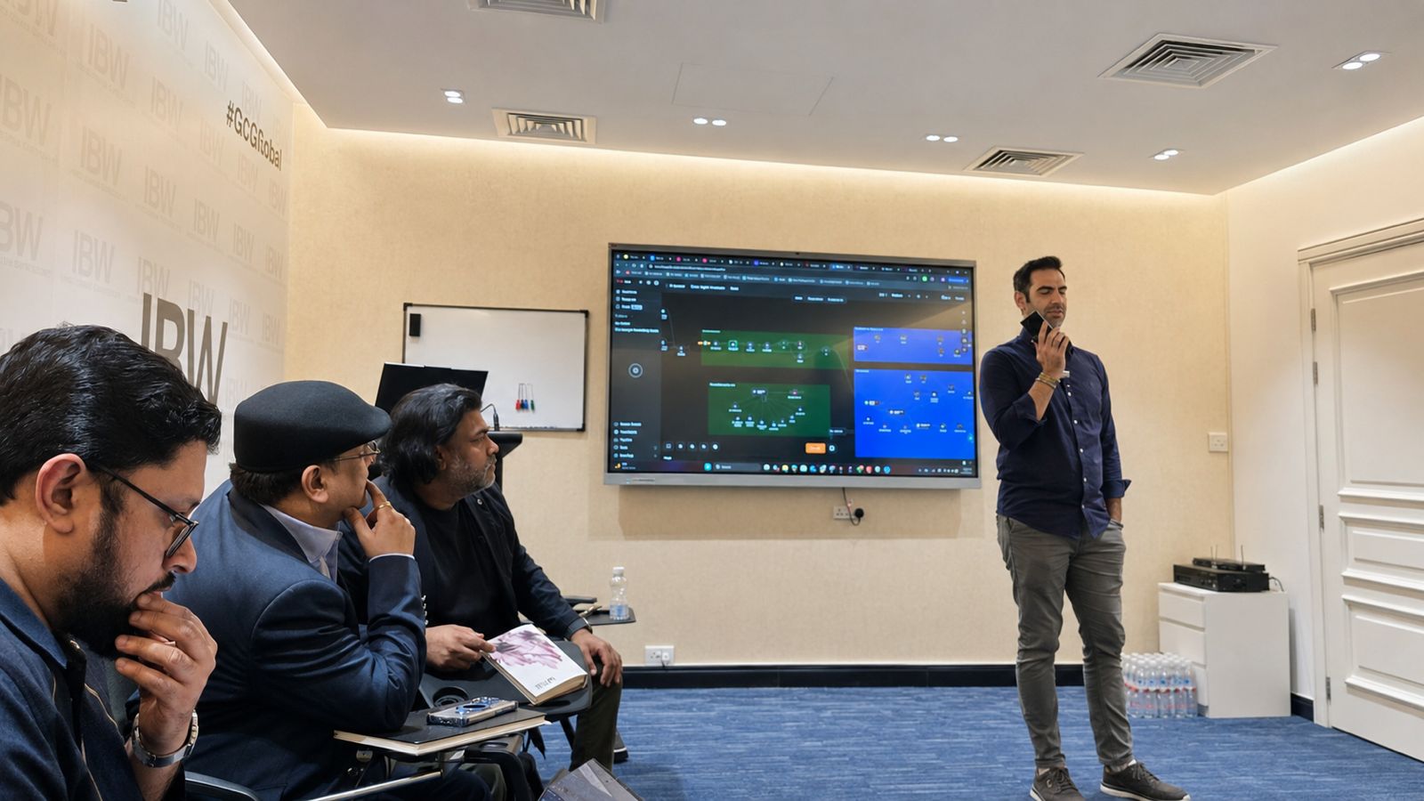 Sam Fouladgar presenting an AI agentic workflow to AI Mavericks members in Doha