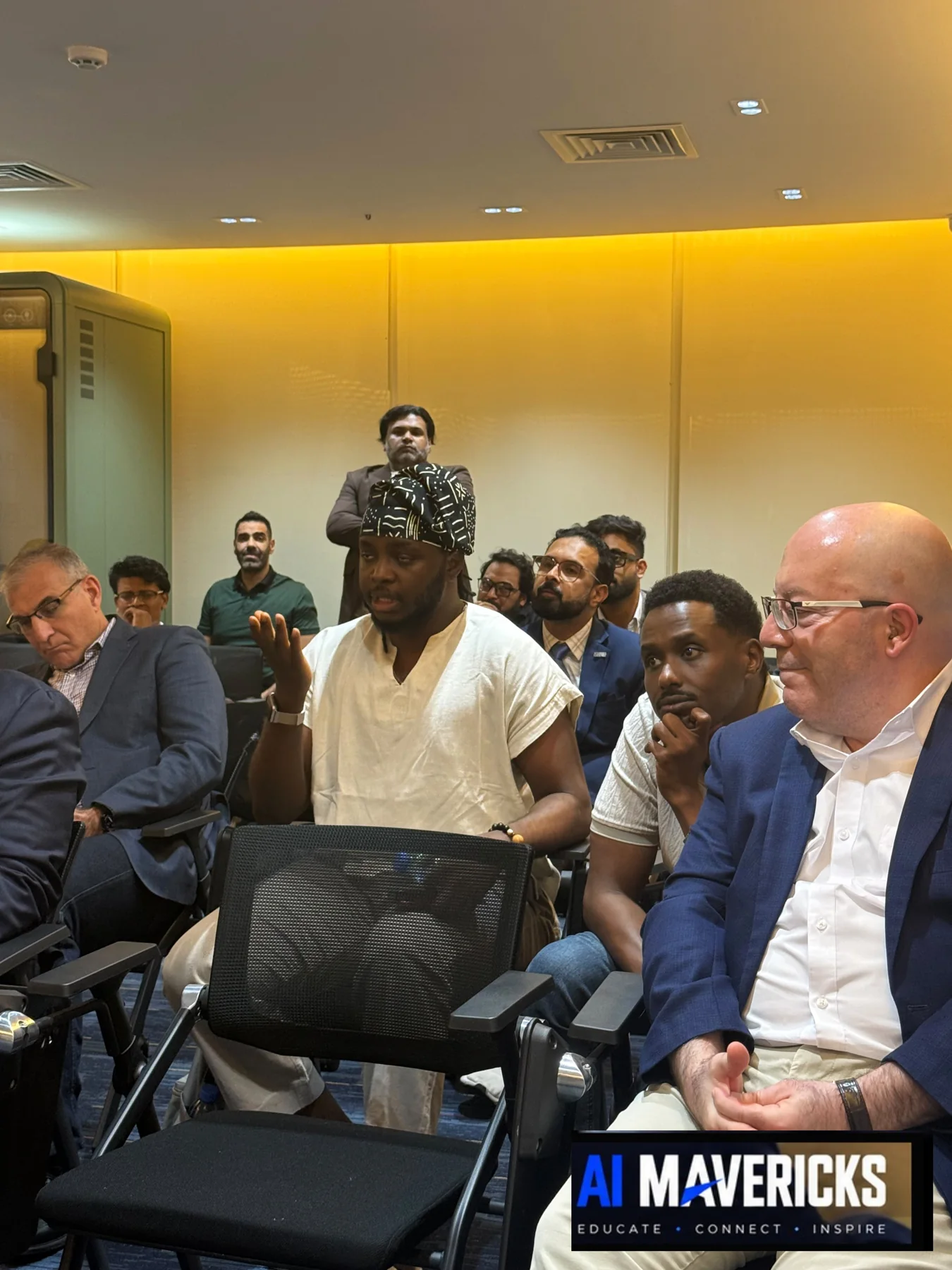 Audience members taking part in a question and answer discussion at the AI Innovation Showcase