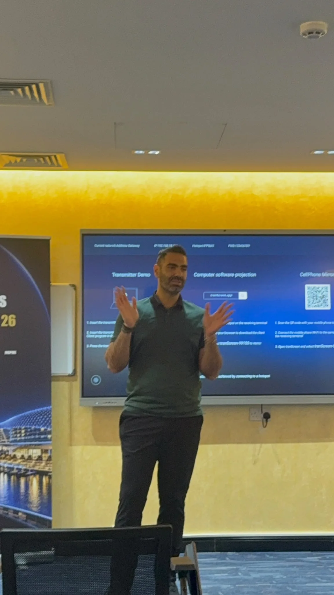 A speaker running a live demonstration on the big screen at the AI Innovation Showcase